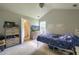 Bedroom with a bed, dresser and TV, and a doorway leading to a bathroom with a sink and vanity at 2538 Wayne Scott Ct, Charleston, SC 29414