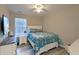 Comfortable bedroom with a queen bed, ceiling fan, and plenty of natural light at 2538 Wayne Scott Ct, Charleston, SC 29414