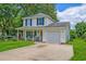 Inviting two-story home featuring a classic design, a well-kept lawn, and a convenient attached garage at 2538 Wayne Scott Ct, Charleston, SC 29414