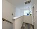 Bright hallway with modern flooring, white walls and a view from the window at the landing at 2538 Wayne Scott Ct, Charleston, SC 29414