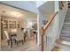 Open interior view showing the dining room, kitchen with breakfast bar and stairs, creating a spacious home design at 2538 Wayne Scott Ct, Charleston, SC 29414