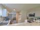 Functional kitchen with stainless steel appliances and modern marble countertops, adjacent to the living room at 2538 Wayne Scott Ct, Charleston, SC 29414