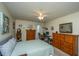 Large bedroom with neutral walls, carpet, ceiling fan, and a comfortable bed with classic wooden furniture at 2601 Riverridge Ct # A, Moncks Corner, SC 29461