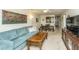 Open-concept living room with cozy sofas and a view to the dining area and kitchen at 2601 Riverridge Ct # A, Moncks Corner, SC 29461