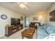 Cozy living room featuring comfortable couches, a TV, and a back door view at 2601 Riverridge Ct # A, Moncks Corner, SC 29461