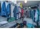Organized walk-in closet featuring shelving, hanging rods, and storage bins at 2601 Riverridge Ct # A, Moncks Corner, SC 29461