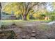Large backyard features a stone walkway and mature trees at 2736 Star Drive, North Charleston, SC 29406