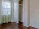 Bedroom with hardwood floors, closet, window, and fresh paint at 2736 Star Drive, North Charleston, SC 29406