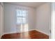 Cozy bedroom featuring hardwood floors and natural light from the large window at 2736 Star Drive, North Charleston, SC 29406