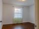 Bright bedroom features hardwood floors, natural light, and neutral walls at 2736 Star Drive, North Charleston, SC 29406
