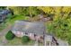Aerial view of a charming brick house with a well-maintained roof, lush landscaping, and mature trees at 2736 Star Drive, North Charleston, SC 29406
