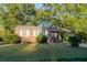 Classic brick home with manicured lawn, trimmed shrubbery, and white shuttered windows at 2736 Star Drive, North Charleston, SC 29406