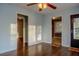 Open living room with hardwood floors and multiple doorways to other rooms at 2736 Star Drive, North Charleston, SC 29406