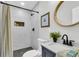 Updated bathroom with gray vanity, black fixtures, and tile shower with niche at 2949 Alabama Dr, North Charleston, SC 29405
