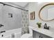 Well-lit bathroom features sleek marble wall tiles, a framed mirror, and black hardware at 2949 Alabama Dr, North Charleston, SC 29405