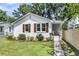 Inviting single-Gathering home with a well-manicured lawn, walkway and a white picket fence offering style and curb appeal at 2949 Alabama Dr, North Charleston, SC 29405