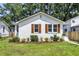 Charming cottage-style home with beautiful landscaping and inviting curb appeal. Freshly painted, updated windows and shutters at 2949 Alabama Dr, North Charleston, SC 29405