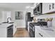 Eat-in kitchen featuring a stainless steel refrigerator, quartz countertops, and new appliances at 2949 Alabama Dr, North Charleston, SC 29405