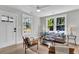 Bright living room with large windows, hardwood floors, neutral walls, and stylish furnishings creating a cozy space at 2949 Alabama Dr, North Charleston, SC 29405