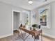 Home office with hardwood floors, natural light from two windows, and stylish desk with modern decor at 2949 Alabama Dr, North Charleston, SC 29405