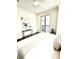 Light and airy bedroom with a sliding door to a balcony, a ceiling fan, and minimalist decor at 30 Nats Ct, Charleston, SC 29403