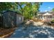 Expansive backyard view featuring a shed, patio furniture, and manicured landscaping at 3002 Waterway Blvd, Isle of Palms, SC 29451