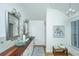 Elegant bathroom with double sink vanity, wood countertop, and modern decor at 3002 Waterway Blvd, Isle of Palms, SC 29451