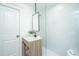 Modern bathroom with stylish vanity, minimalist design and shower with glass screen at 3002 Waterway Blvd, Isle of Palms, SC 29451
