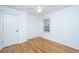 Bright bedroom features hardwood floors, a ceiling fan, and a window providing natural light at 3002 Waterway Blvd, Isle of Palms, SC 29451
