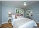 Charming bedroom with hardwood floors and ample natural light from the windows at 3002 Waterway Blvd, Isle of Palms, SC 29451