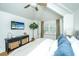 Bright bedroom with light colored walls, hardwood floors, tv, and lots of natural light at 3002 Waterway Blvd, Isle of Palms, SC 29451