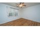 Cozy bedroom featuring hardwood floors, a window, and a ceiling fan at 3002 Waterway Blvd, Isle of Palms, SC 29451