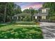 Charming home with a landscaped front yard, walkway, and mature trees at 3002 Waterway Blvd, Isle of Palms, SC 29451