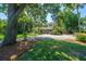 Charming home with a swing and landscaped front yard and gravel driveway at 3002 Waterway Blvd, Isle of Palms, SC 29451