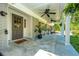 Cozy front porch with rocking chairs, ceiling fans, and a welcoming entrance at 3002 Waterway Blvd, Isle of Palms, SC 29451