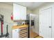 Bright kitchen area featuring stainless steel refrigerator and wine cooler with white cabinets at 3002 Waterway Blvd, Isle of Palms, SC 29451