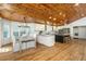 Eat-in kitchen with wooden ceiling, center island, stainless appliances, and plenty of natural light from multiple windows at 3002 Waterway Blvd, Isle of Palms, SC 29451
