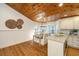 Eat-in kitchen with wooden ceiling, center island, plenty of counter space, and hardwood floors at 3002 Waterway Blvd, Isle of Palms, SC 29451