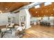 Bright living room with a fireplace, wood ceiling, and an open kitchen at 3002 Waterway Blvd, Isle of Palms, SC 29451