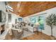 Bright living room featuring a fireplace, wood ceiling, and views to the back at 3002 Waterway Blvd, Isle of Palms, SC 29451