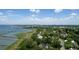 Aerial view showcasing waterfront property with long private docks, lush greenery, and scenic river views at 320 Morrison Street, Mount Pleasant, SC 29464
