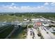 An aerial view of a waterfront city featuring a marina, restaurants, and a bridge in the background at 320 Morrison Street, Mount Pleasant, SC 29464