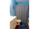 Cozy bathroom with blue accents, striped shower curtain, and classic fixtures at 320 Morrison Street, Mount Pleasant, SC 29464