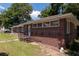 Charming brick home with a lush lawn and classic architectural details at 320 Morrison Street, Mount Pleasant, SC 29464