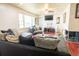 Inviting living room with comfortable seating and a charming brick fireplace feature at 320 Morrison Street, Mount Pleasant, SC 29464