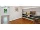 Bedroom features built in shelving, and a window overlooking nature and hardwood floors at 338 Mcclellan Ave, McClellanville, SC 29458