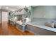 Bedroom features built-in bunk beds, storage, a bench, and hardwood floors at 338 Mcclellan Ave, McClellanville, SC 29458