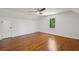 Bedroom features a vaulted ceiling, hardwood floors, and a modern ceiling fan at 338 Mcclellan Ave, McClellanville, SC 29458