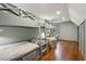 Bedroom features built in bunk beds with storage, a bench, and hardwood floors at 338 Mcclellan Ave, McClellanville, SC 29458