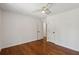 Bright bedroom features beautiful hardwood floors and a modern ceiling fan at 338 Mcclellan Ave, McClellanville, SC 29458